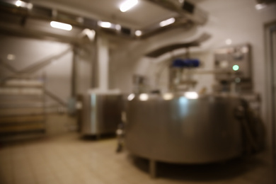 Photo of Blurred view of curd preparation tank at cheese factory