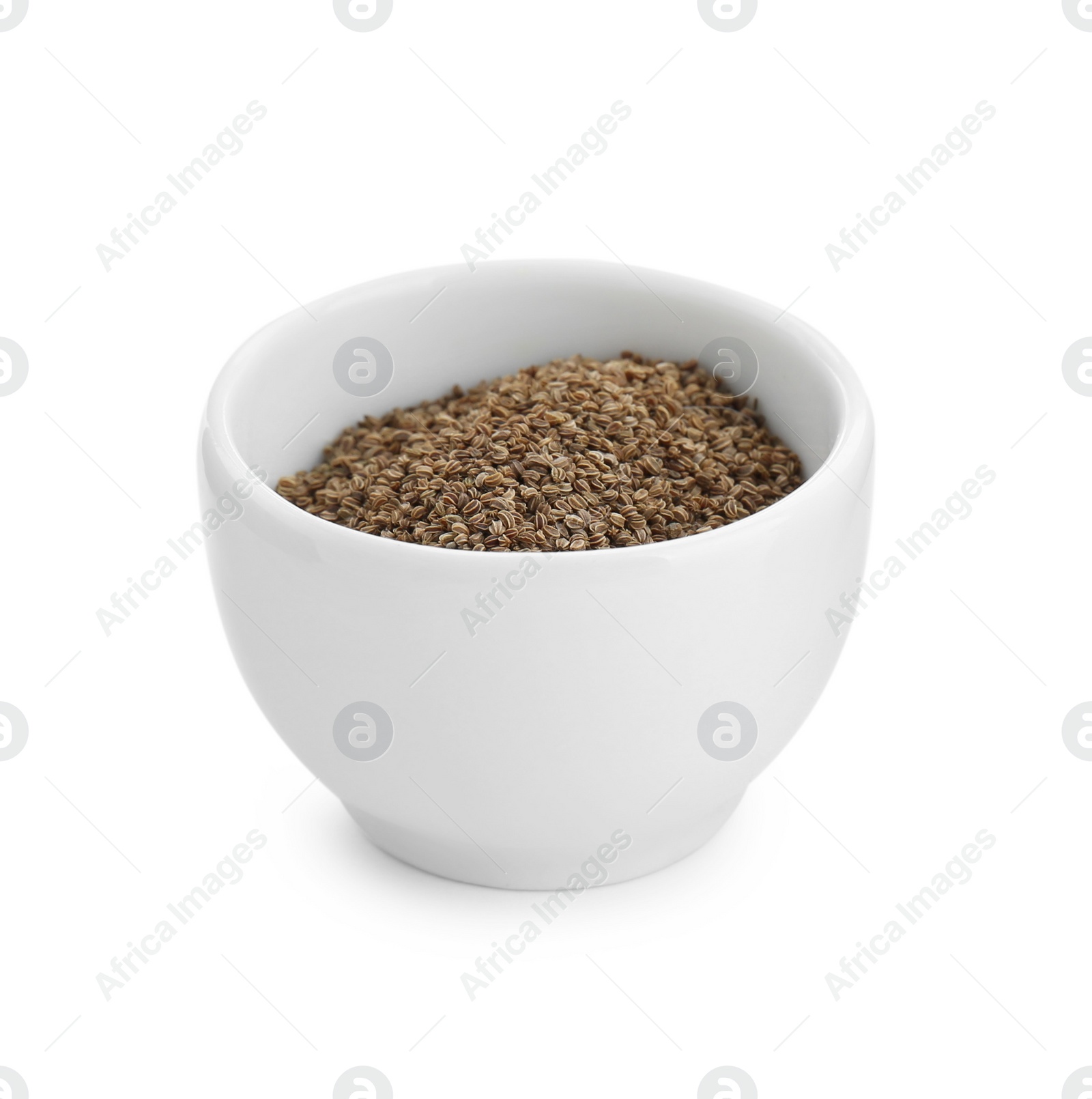 Photo of Bowl of celery seeds isolated on white