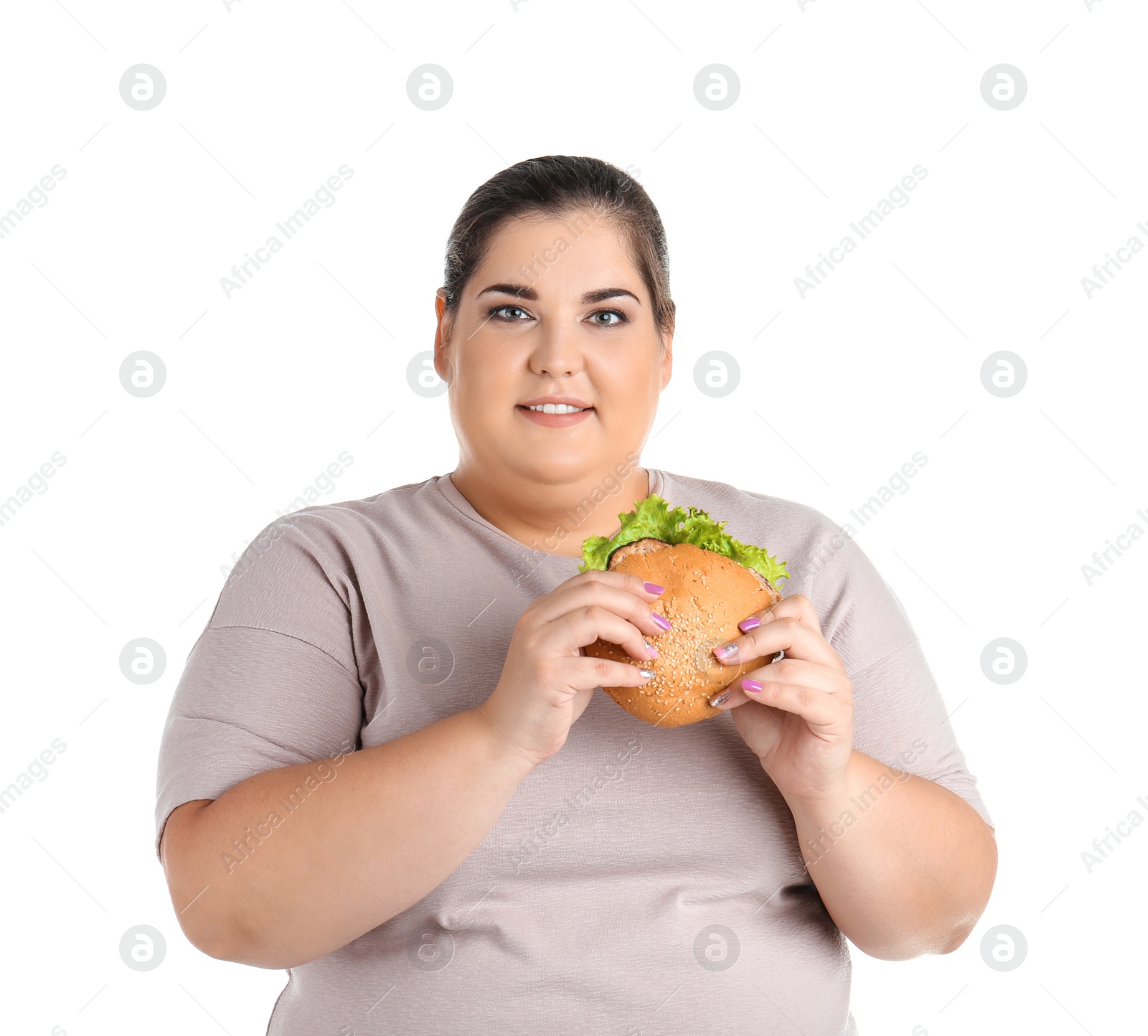 Photo of Overweight woman with hamburger on white background