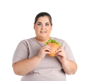 Overweight woman with hamburger on white background