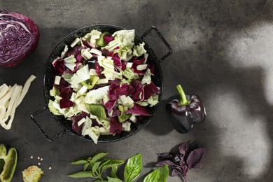 Photo of Delicious salad with Chinese cabbage, suluguni cheese and bell pepper on grey table, flat lay