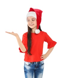 Photo of Cute little child in Santa hat on white background. Christmas celebration