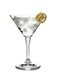 Glass of classic martini cocktail with ice cubes and lemon zest on white background