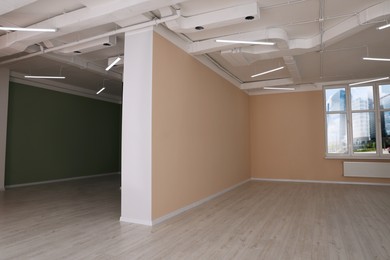 Photo of Empty office rooms with color walls and window. Interior design