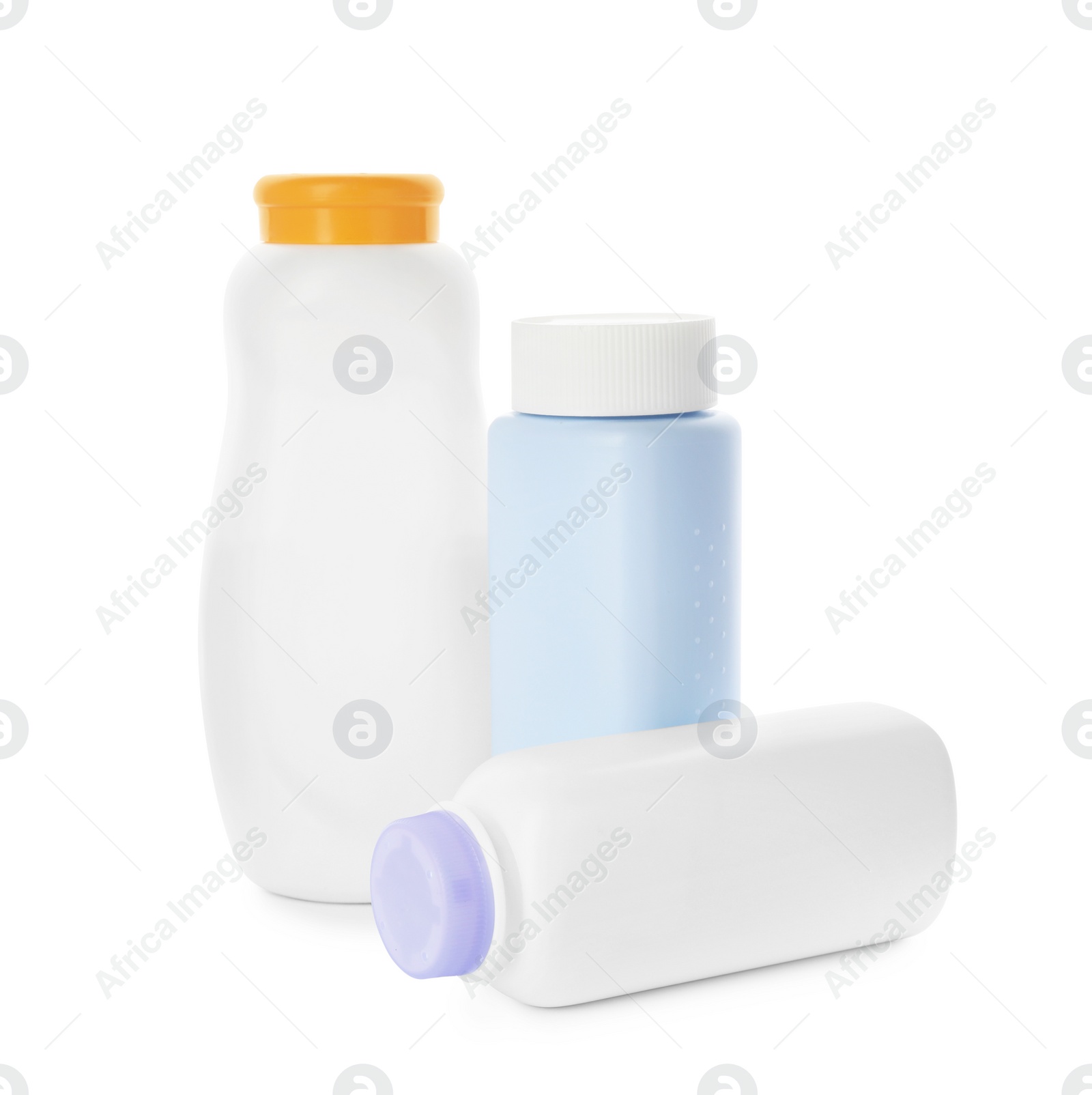 Photo of Bottles of dusting powder on white background, space for design. Baby cosmetic product