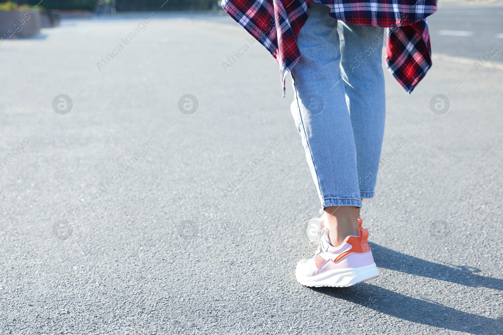 Photo of Woman walking outdoors, closeup with space for text. Choosing way concept.