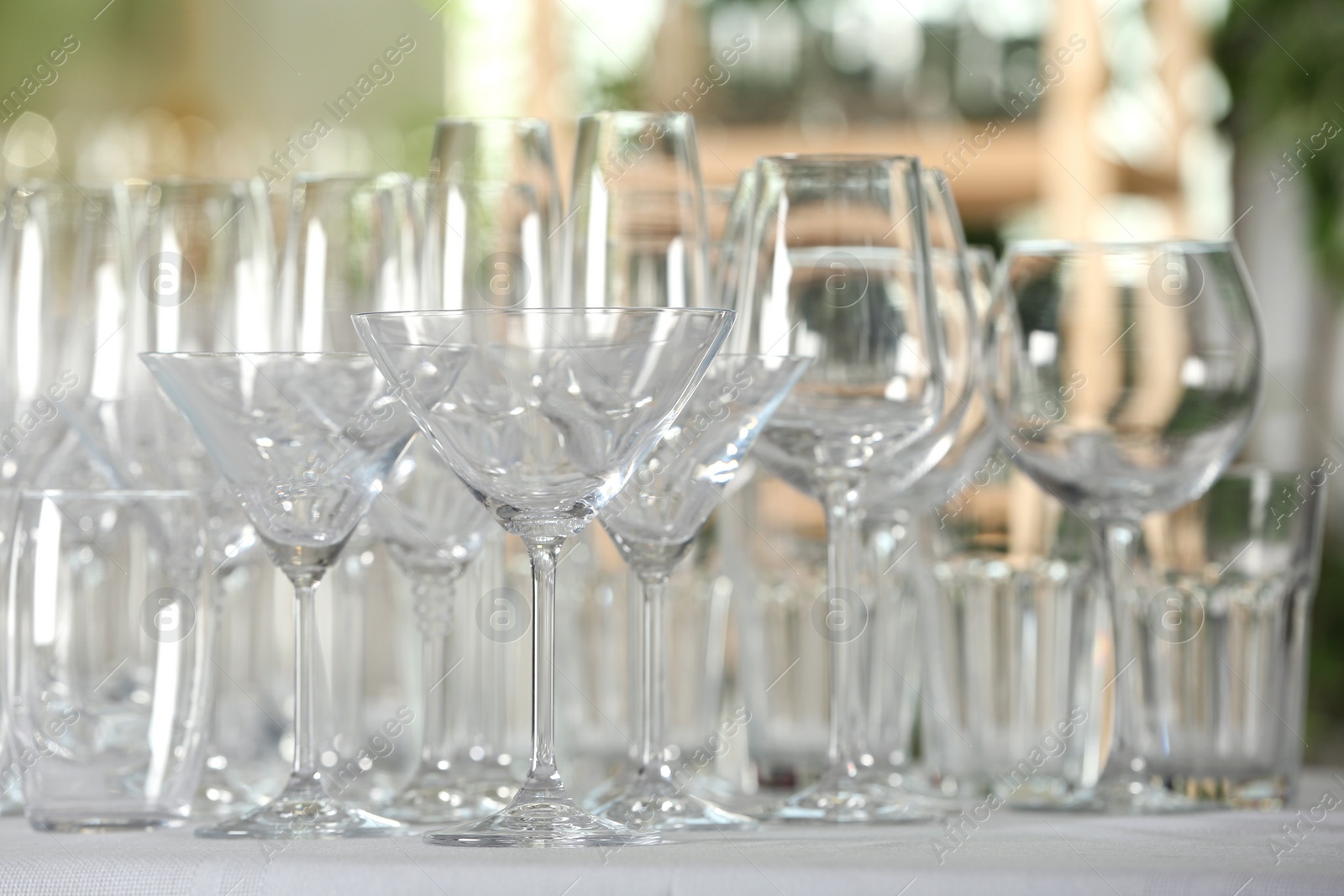 Photo of Set of empty glasses on table indoors