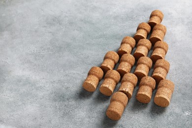 Christmas tree made of wine corks on grey table. Space for text