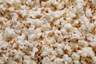 Photo of Tasty pop corn as background, top view