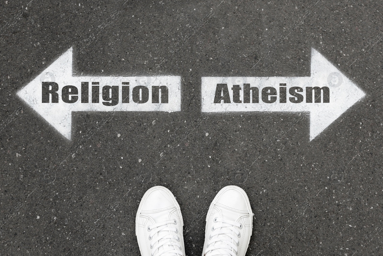 Image of Choice between atheism and religion. Woman standing on road near arrows marking, top view