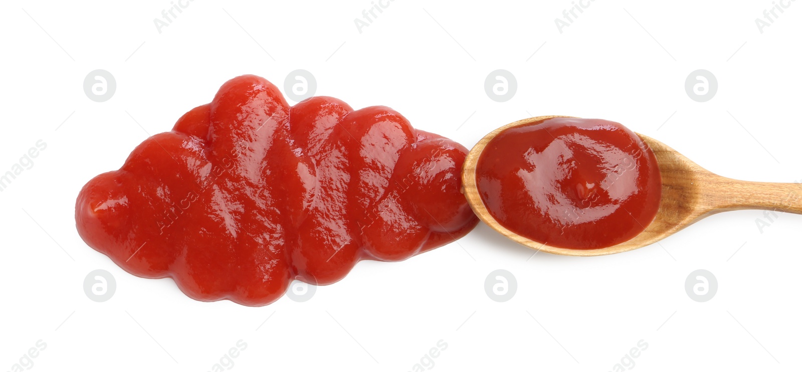 Photo of Tasty ketchup with spoon isolated on white, top view. Tomato sauce