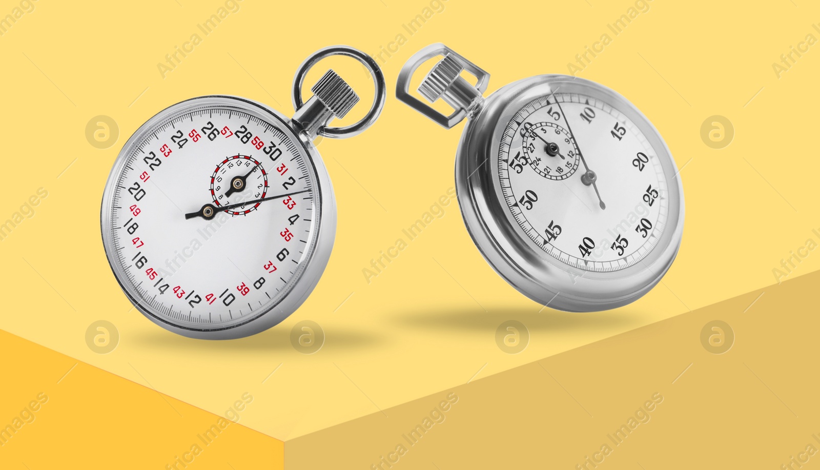 Image of Concept of time. Vintage timers in air on yellow background