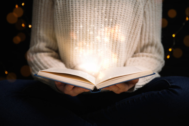 Image of Woman with magic book, closeup. Fairy tale