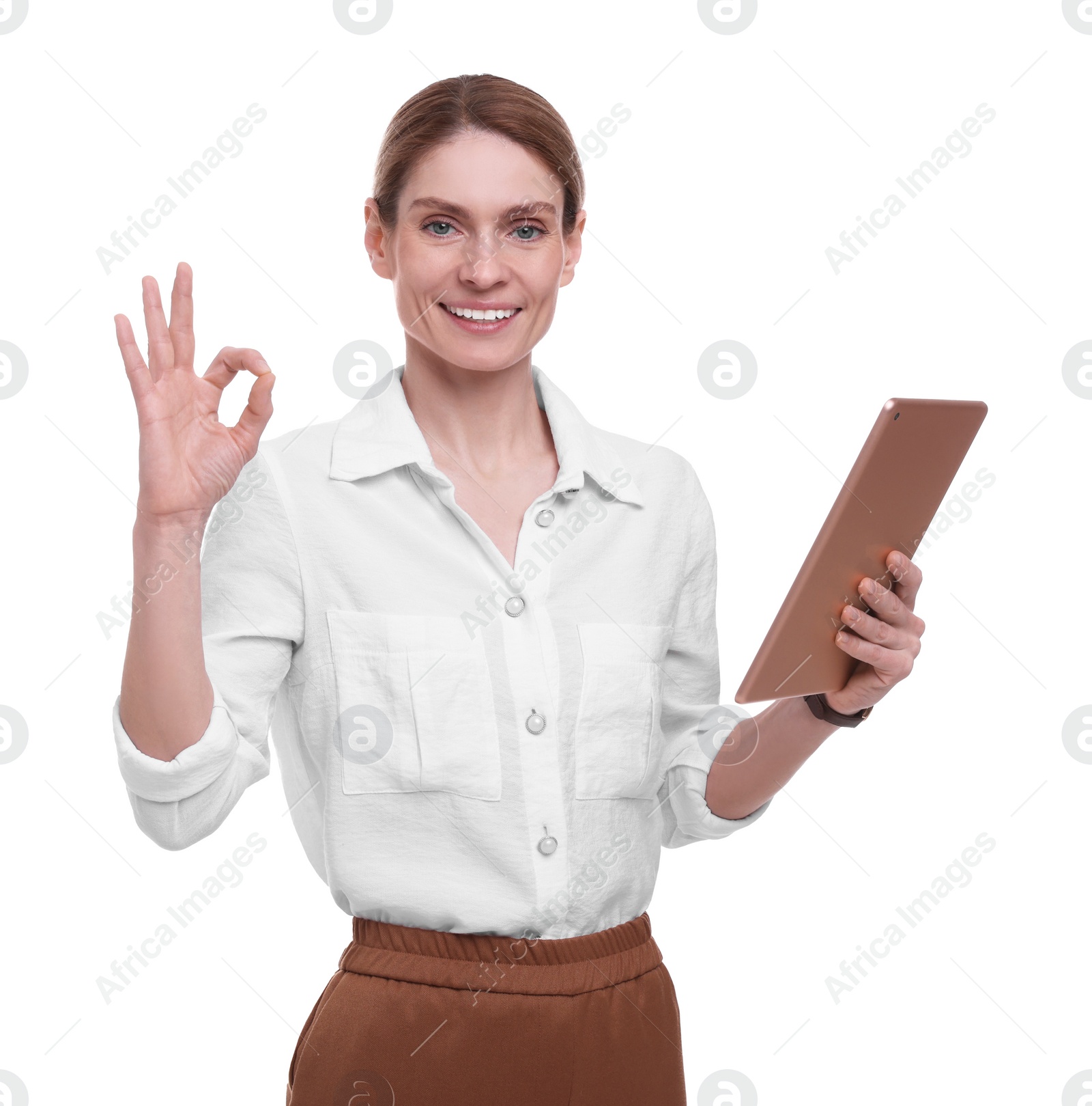 Photo of Beautiful happy businesswoman with tablet showing ok gesture on white background