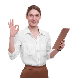 Photo of Beautiful happy businesswoman with tablet showing ok gesture on white background