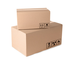 Image of Cardboard parcels with different packaging symbols on white background  