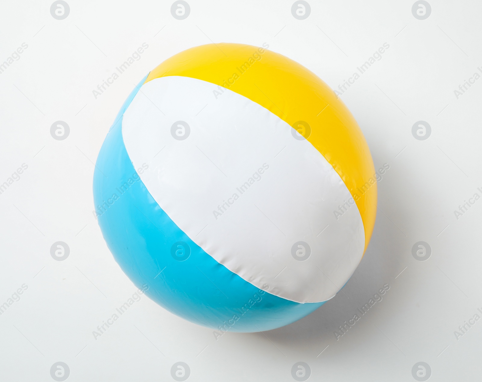 Photo of Inflatable ball on white background. Beach object