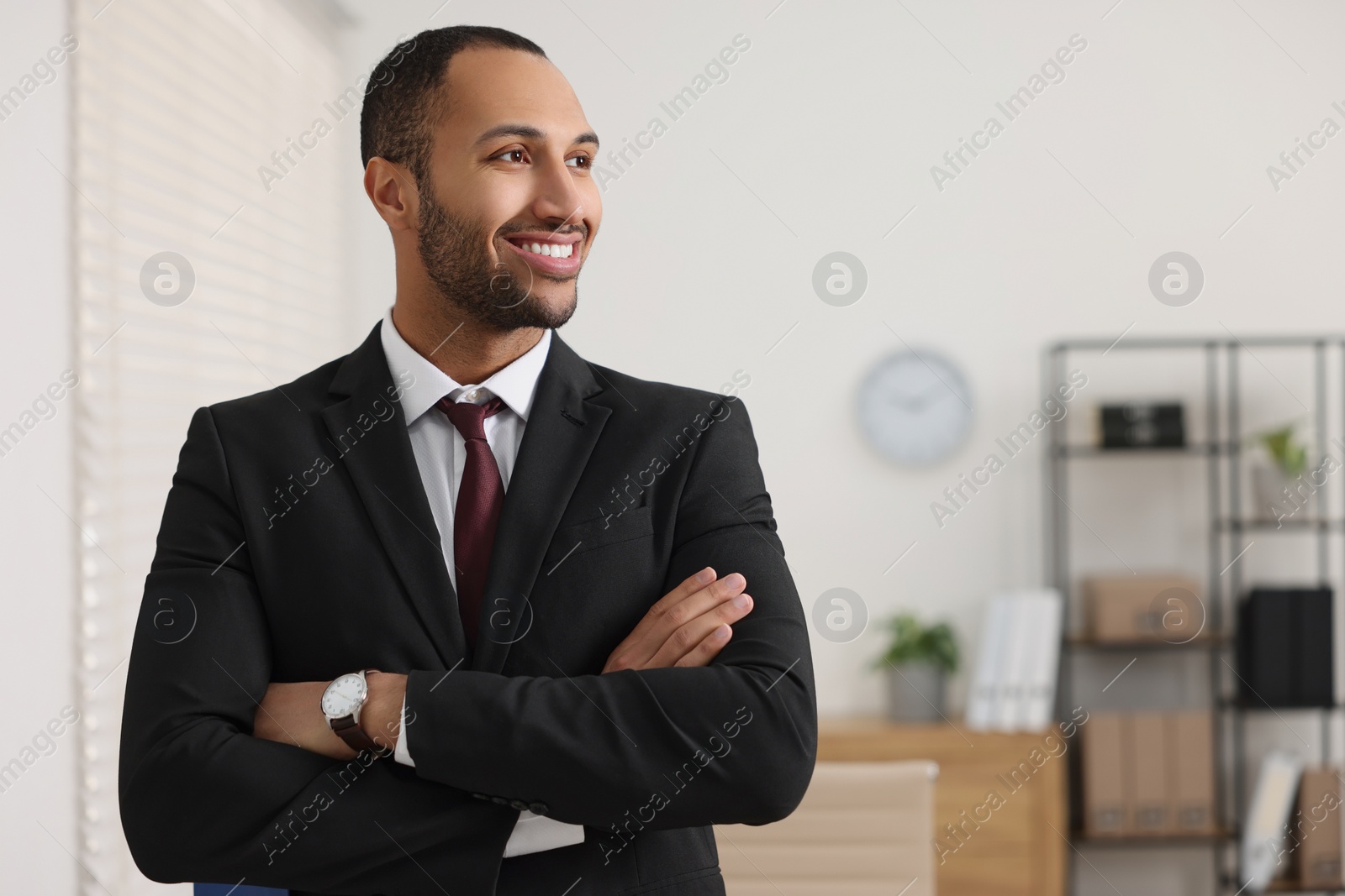 Photo of Portrait of smiling young man in office, space for text. Lawyer, businessman, accountant or manager