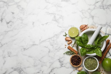 Photo of Different natural spices and herbs on white marble table, flat lay. Space for text