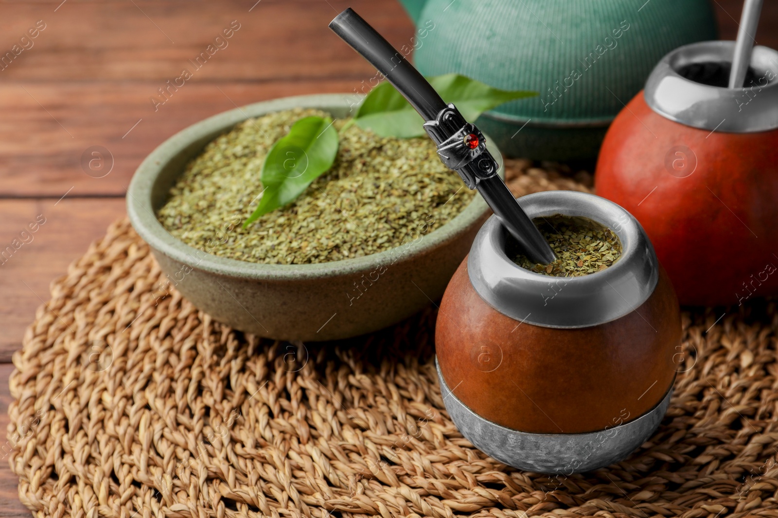 Photo of Calabashes with mate tea and bombilla on table