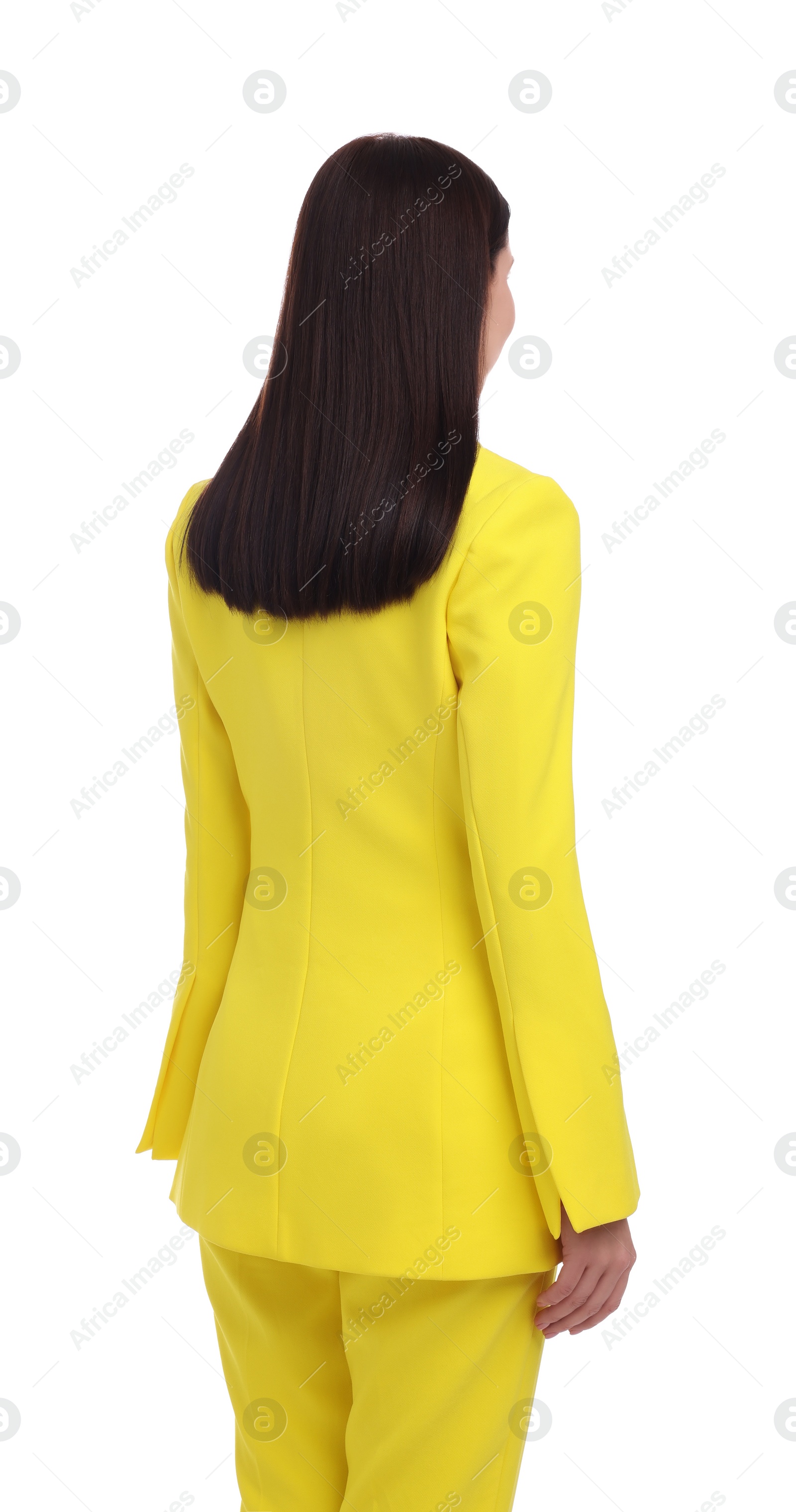 Photo of Businesswoman in yellow suit standing on white background