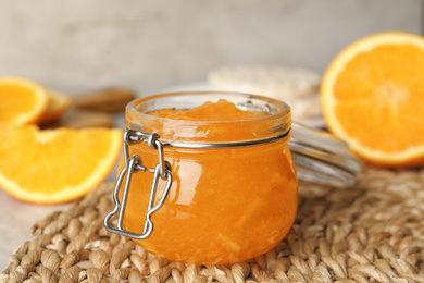 Photo of Homemade delicious orange jam on rattan mat