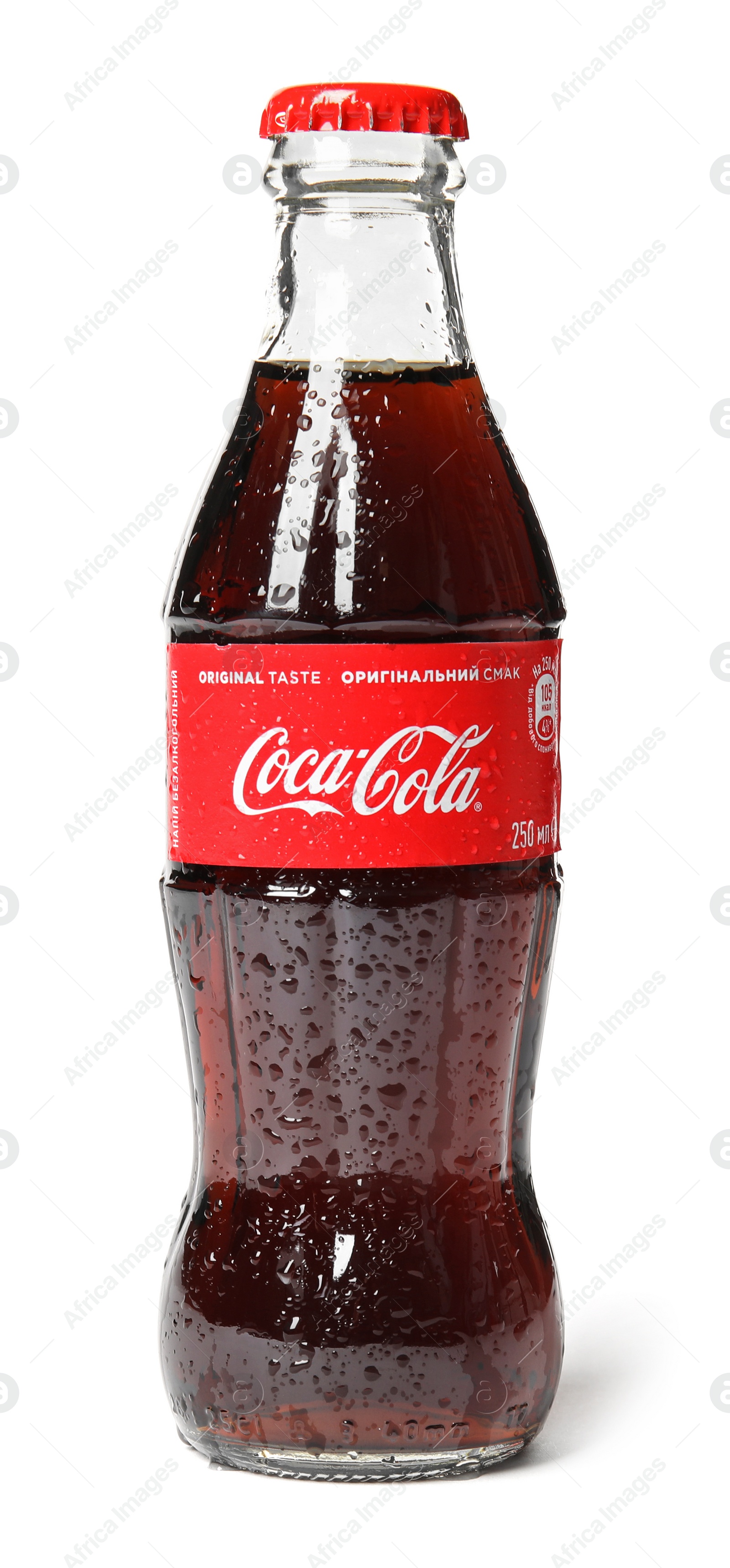 Photo of MYKOLAIV, UKRAINE - NOVEMBER 15, 2018: Glass bottle of Coca Cola on white background