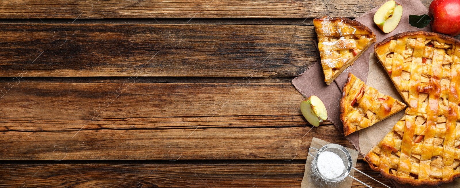 Image of Traditional apple pie and space for text on wooden table, flat lay. Banner design