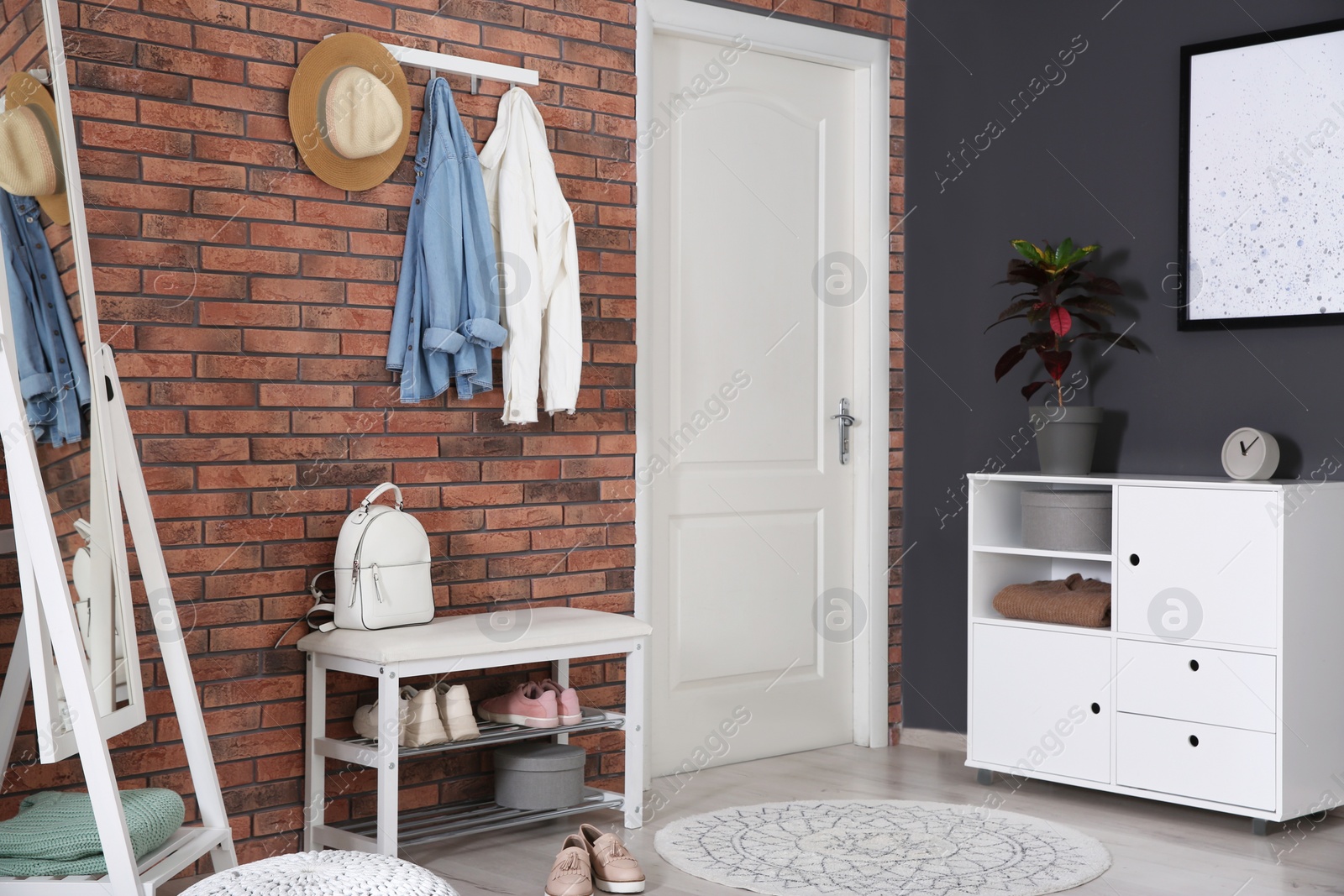 Photo of Modern hallway with stylish furniture. Interior design