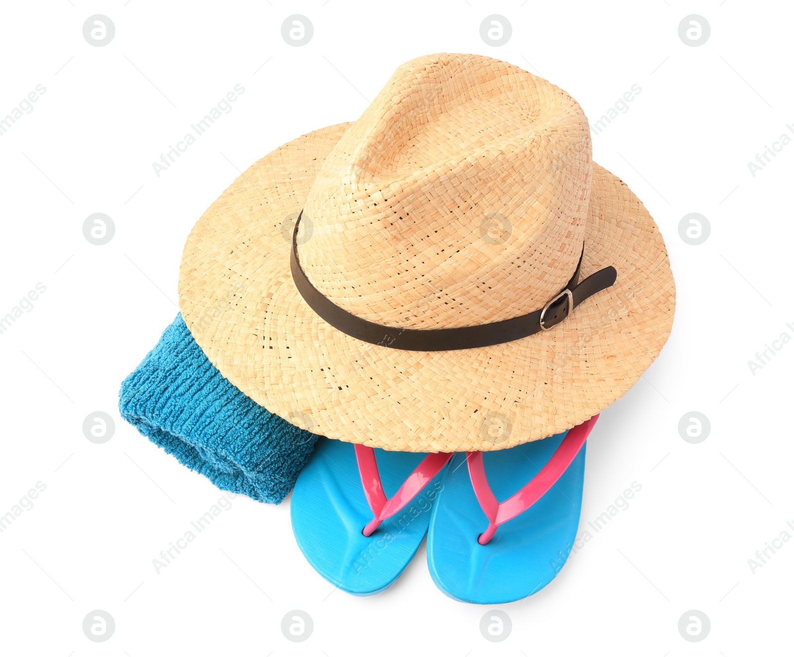 Photo of Straw hat, towel and flip flops isolated on white, above view. Beach objects