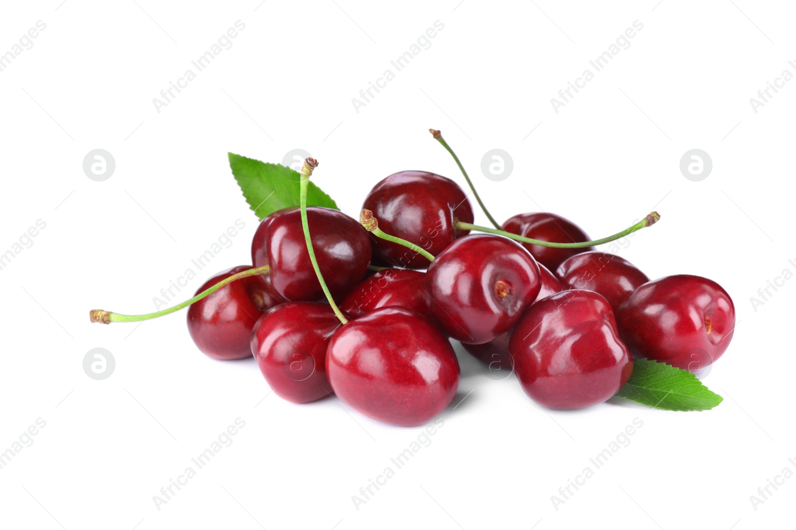 Photo of Tasty ripe red cherries with green leaves isolated on white