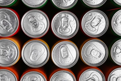 Energy drinks in wet cans, top view. Functional beverage