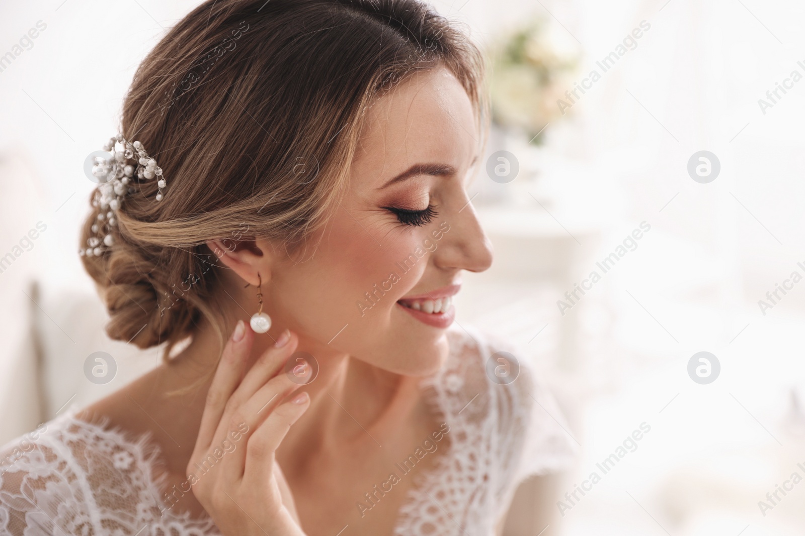 Photo of Gorgeous bride in beautiful wedding dress indoors. Space for text