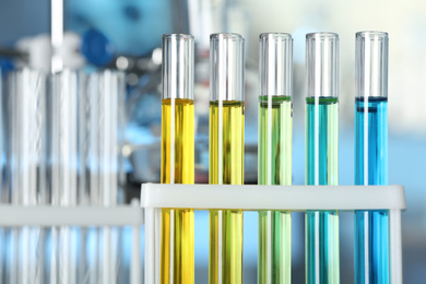 Test tubes with liquid samples in rack, closeup. Laboratory analysis