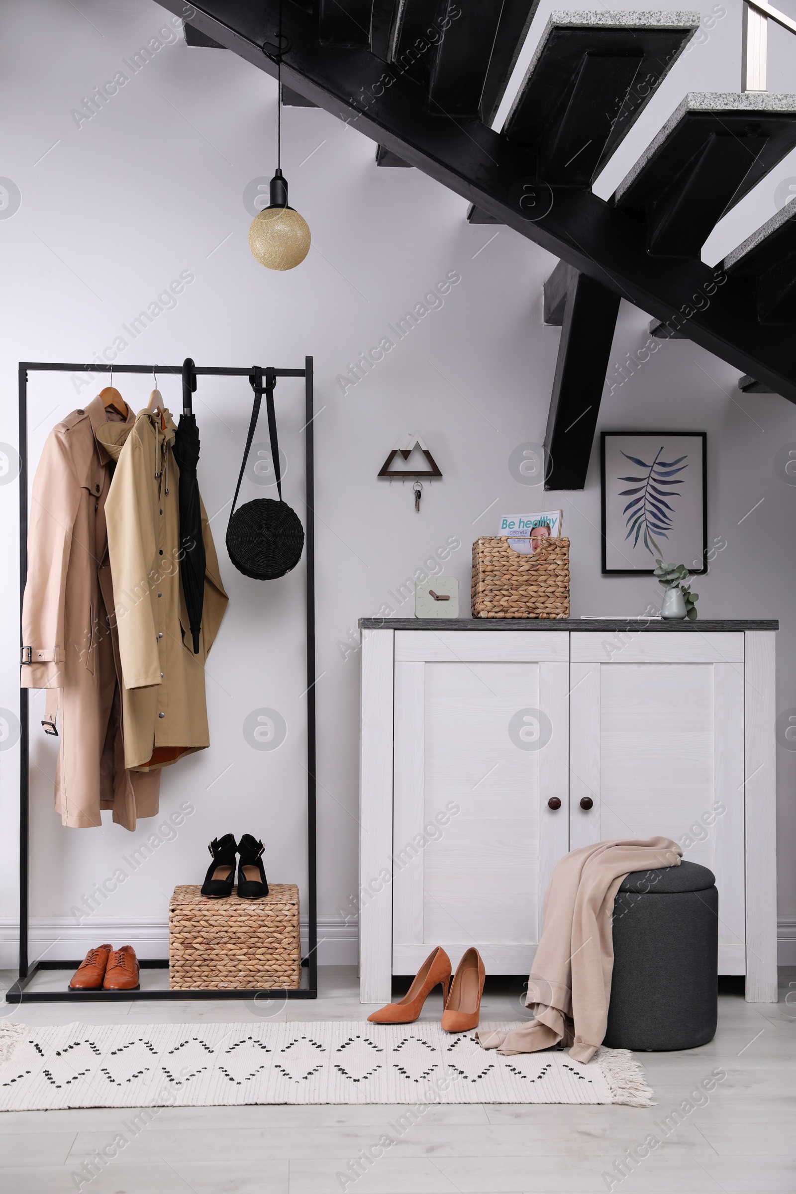 Photo of Modern hallway interior with stylish furniture and key holder