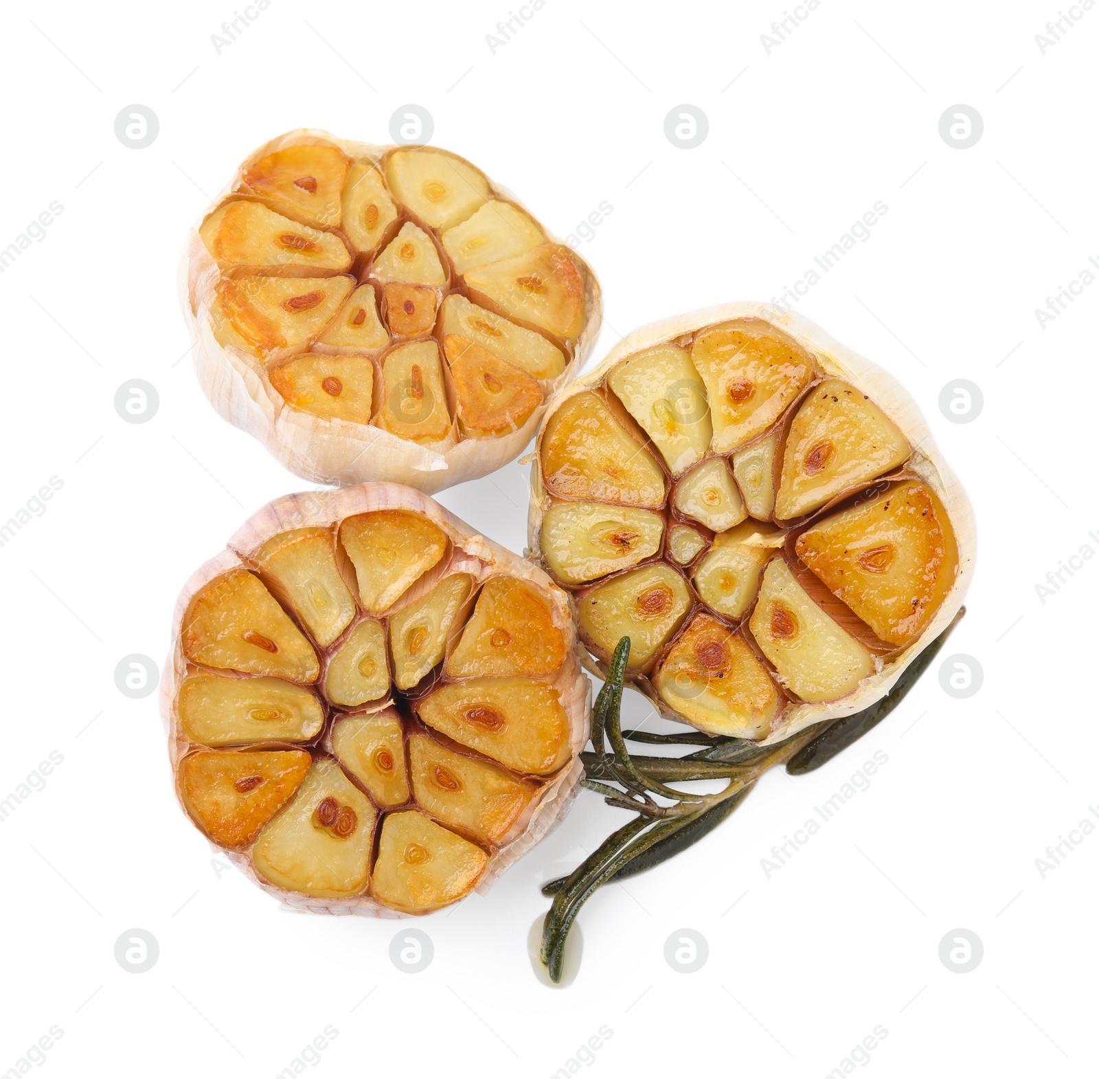 Photo of Heads of fried garlic and rosemary isolated on white, top view