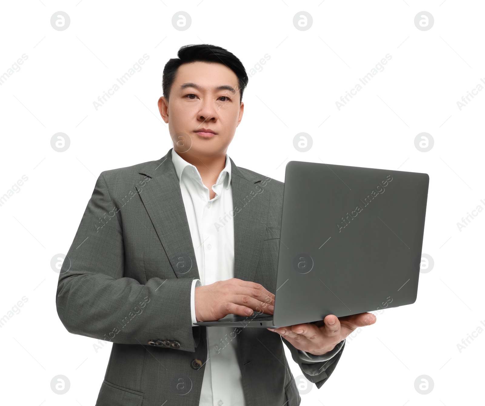 Photo of Businessman in suit working on laptop against white background