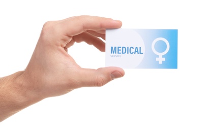 Photo of Man holding medical business card isolated on white, closeup. Women's health service