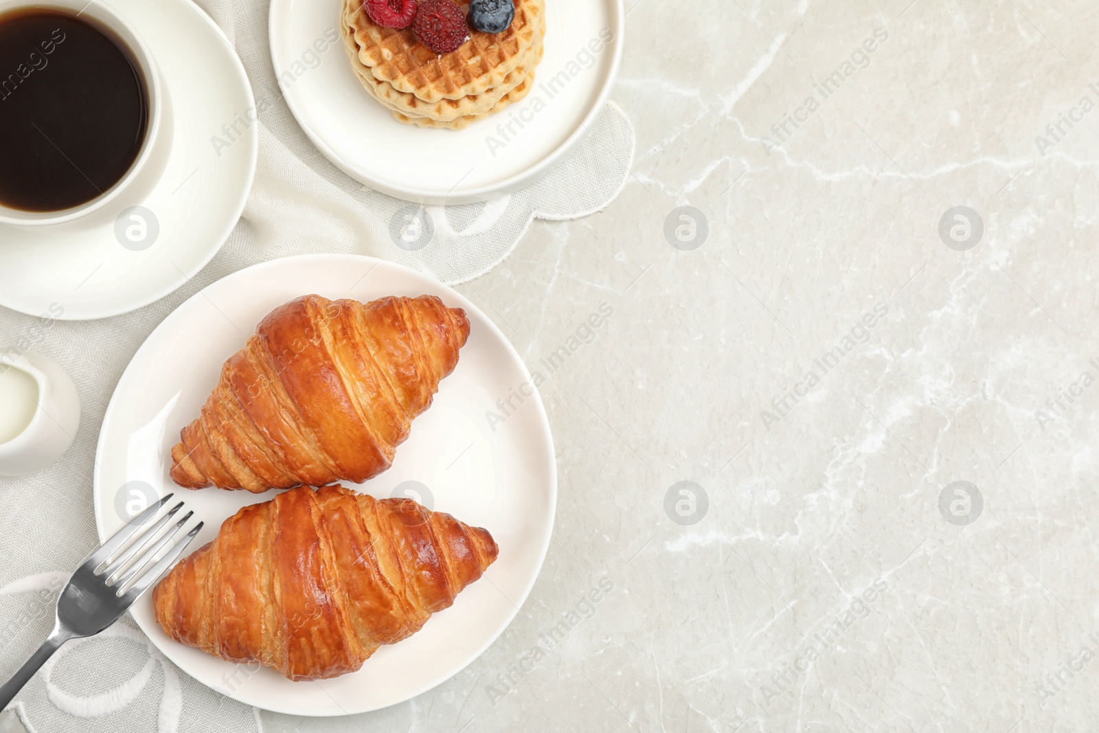 Photo of Delicious breakfast served on light table, flat lay. Space for text