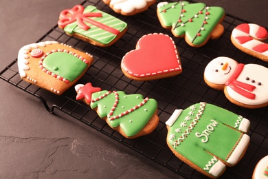 Photo of Delicious Christmas cookies on cooling rack, closeup