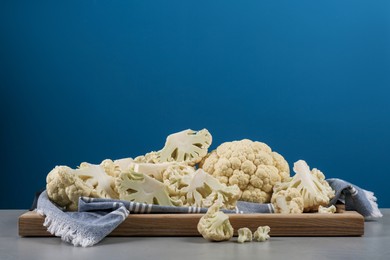 Fresh raw cauliflower on light grey table