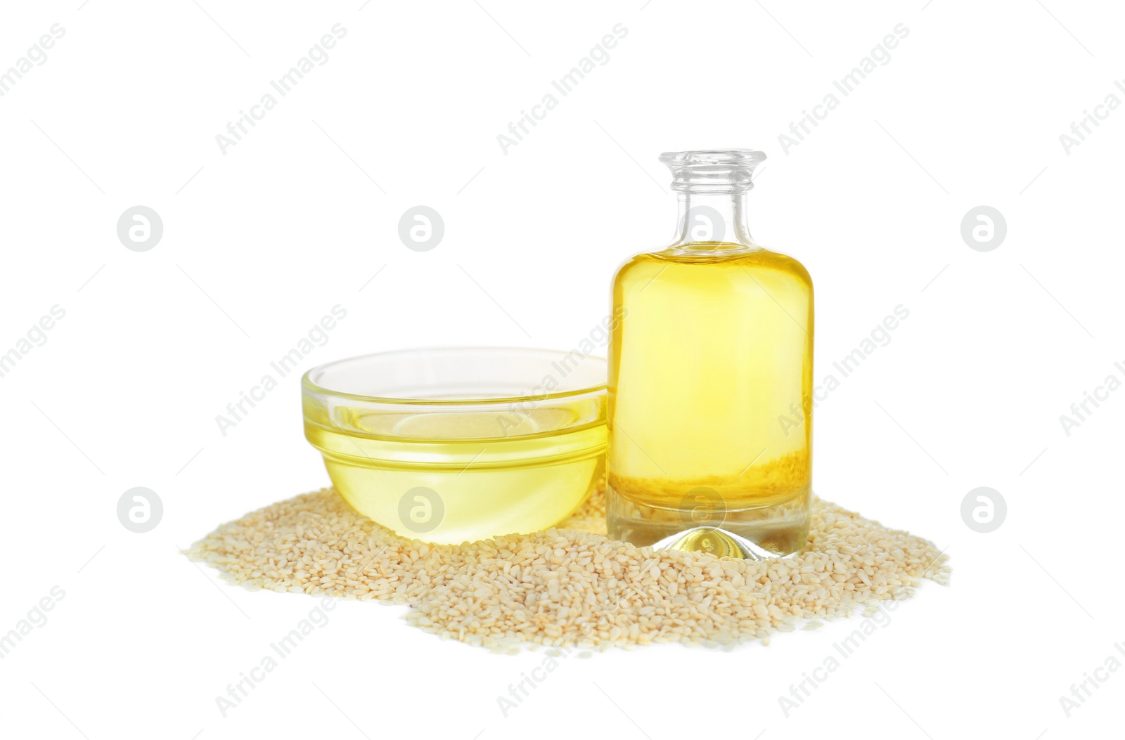 Photo of Fresh sesame oil and seeds isolated on white
