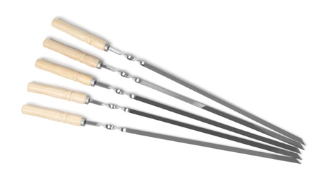 Metal skewers with wooden handle on white background, top view