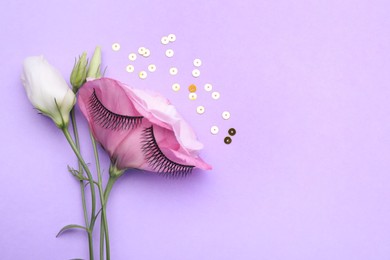 Photo of Flat lay composition with false eyelashes, flowers and sequins on violet background. Space for text