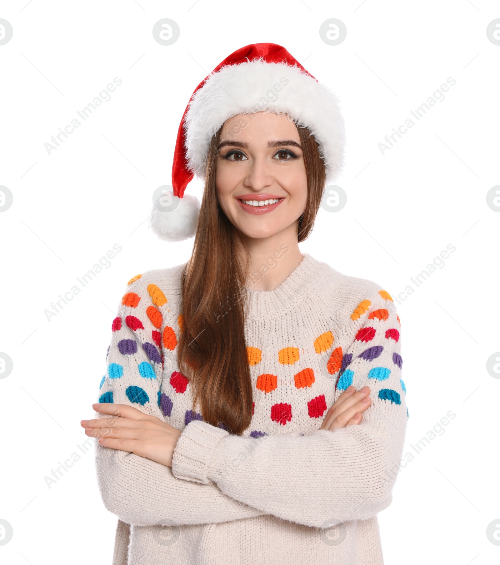 Photo of Happy young woman in sweater and Santa hat on white background. Christmas celebration