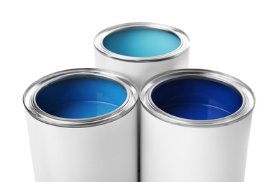 Photo of Open paint cans on white background, closeup