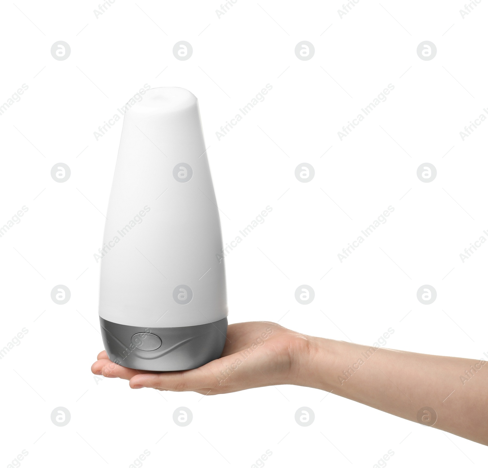 Photo of Woman holding aroma oil diffuser on white background. Air freshener