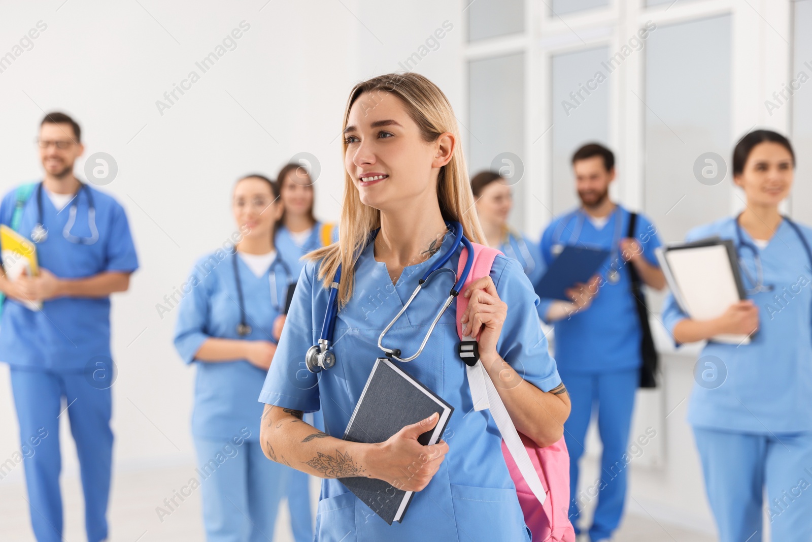 Photo of Young medical student with her classmates in university