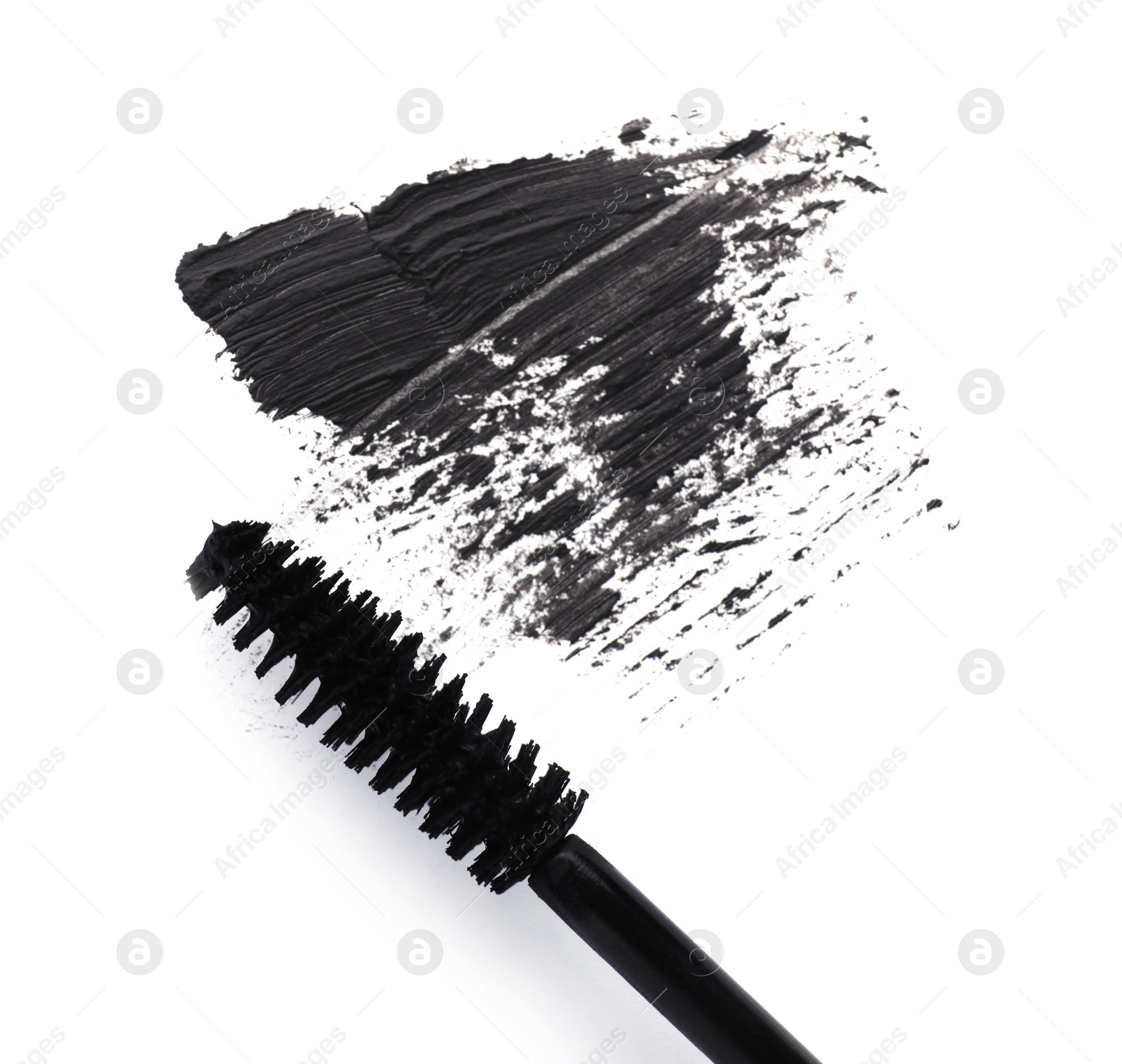 Photo of Applicator and black mascara smear on white background, top view