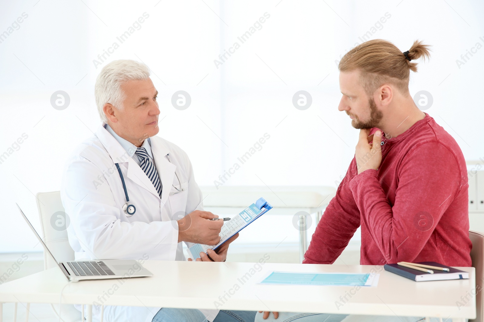 Photo of Man with health problems visiting urologist at hospital